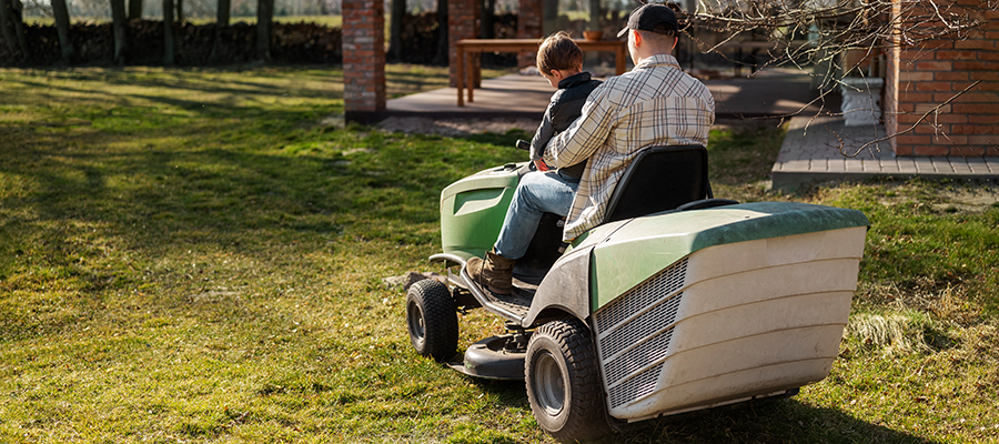 full-shot-man-driving-lawn-mower.jpg